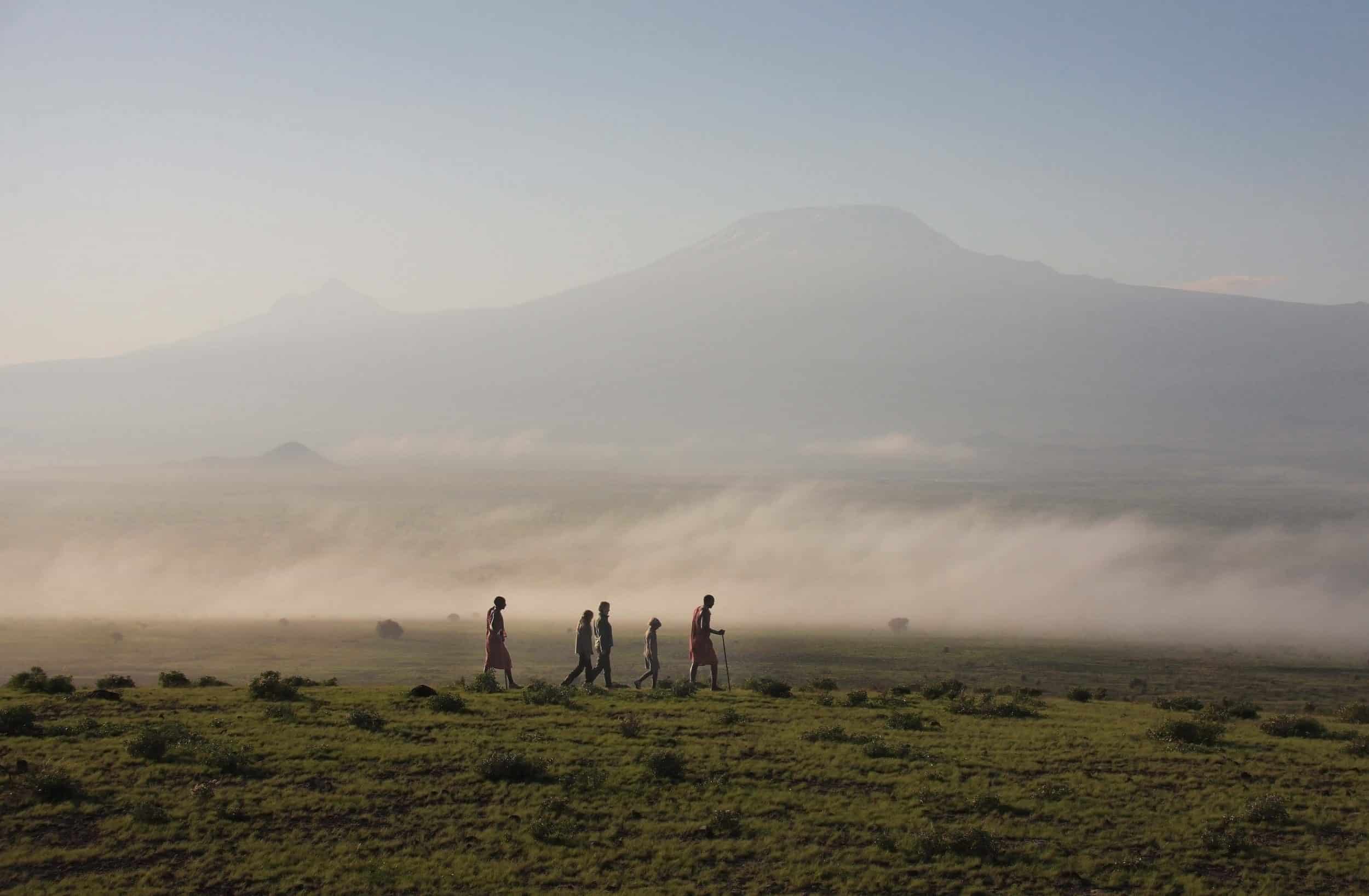 Tortilis-Camp-activities-bush-walk-with-the-backdrop-of-Mt-Kilimanjaro-2