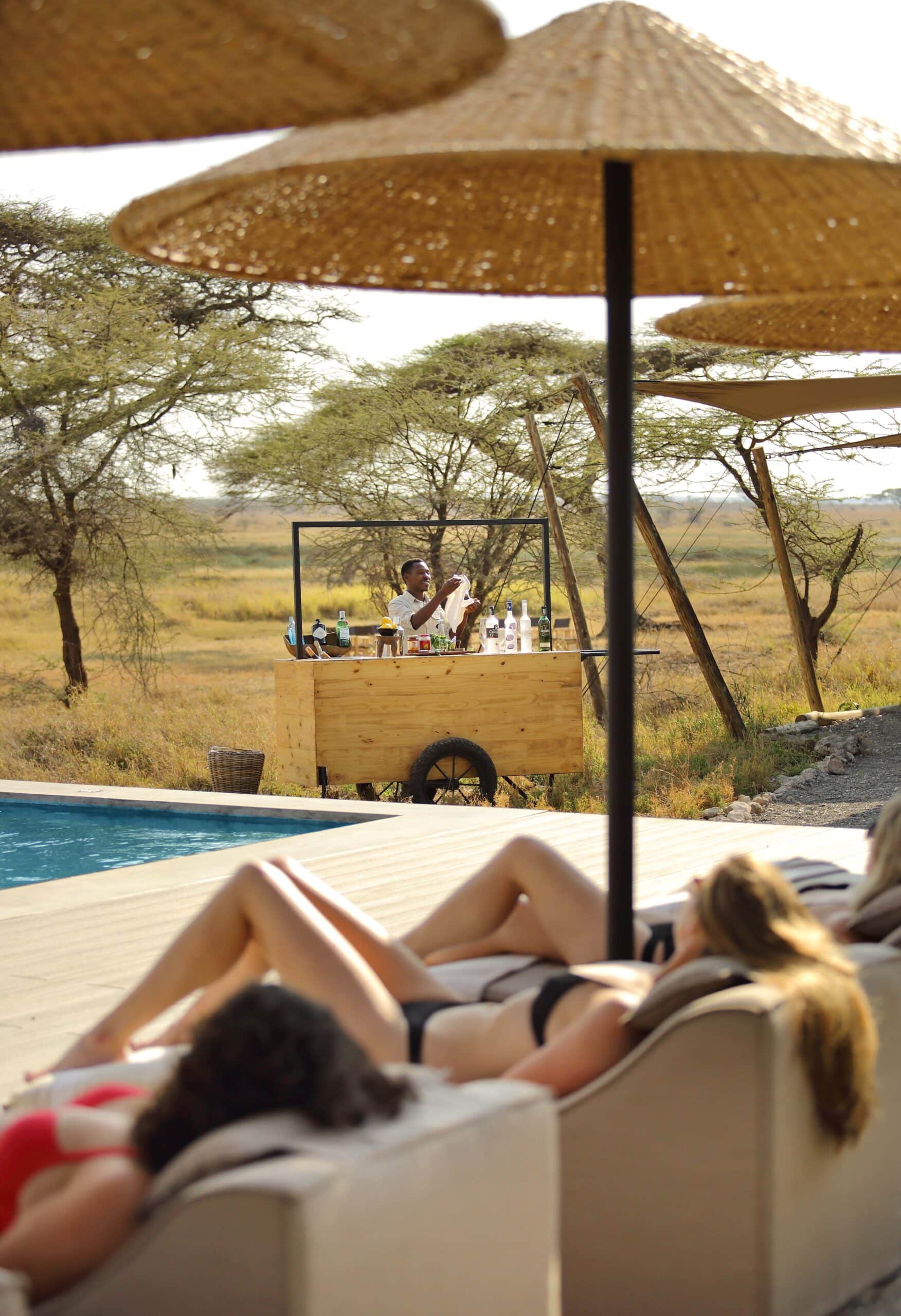 Namiri Plains - Relaxing by pool